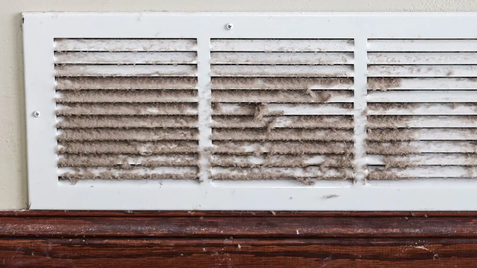 How Colorado's Dry Climate Affects Dust in Your Home feature image: A very dusty home vent